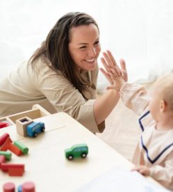 mother-baby-daughter-giving-high-fives